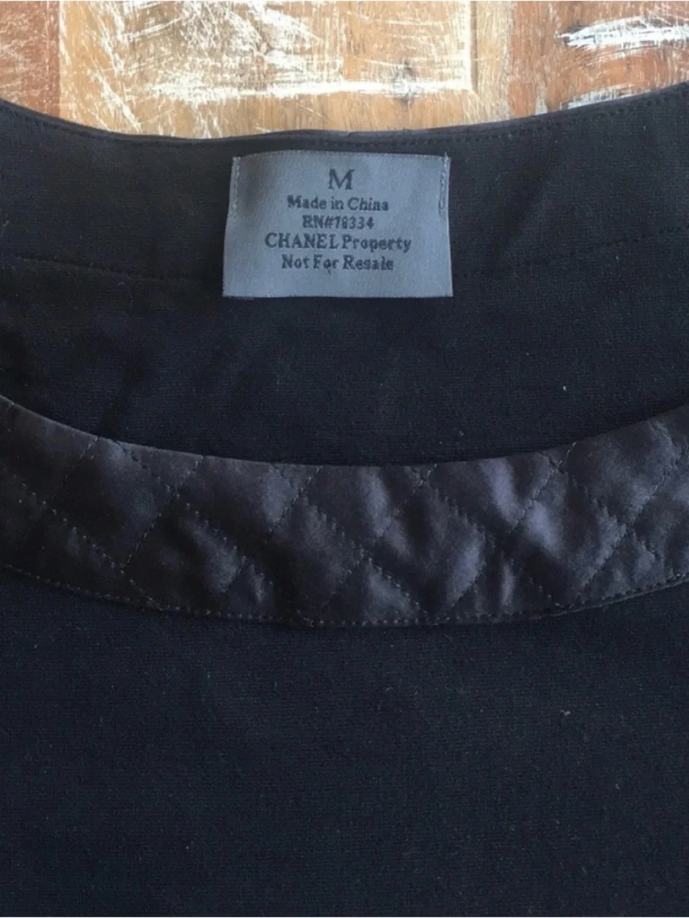 CHANEL black quilted boatneck employee uniform top